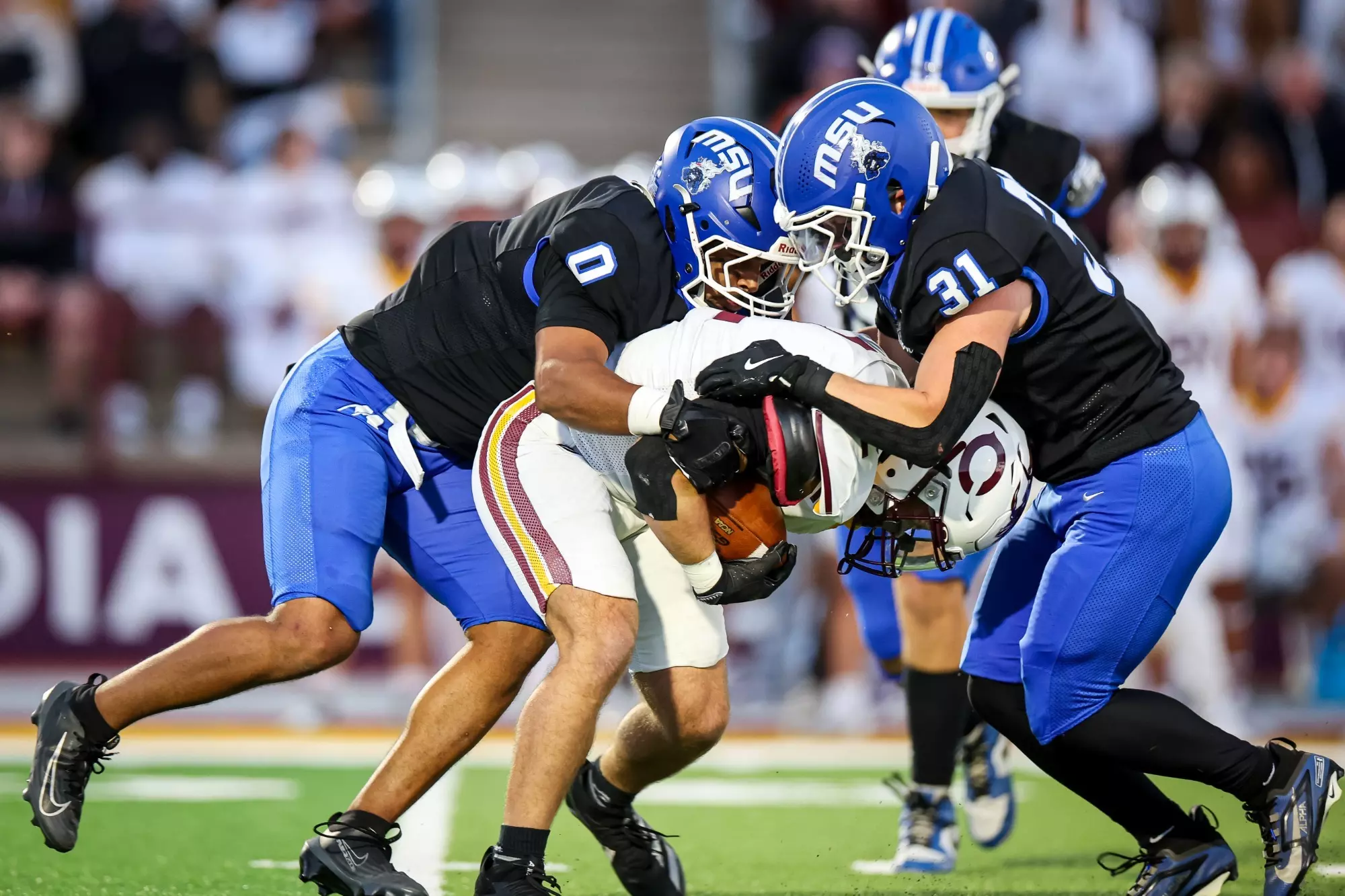 Devon Woods wrapping up a ball carrier for a tackle